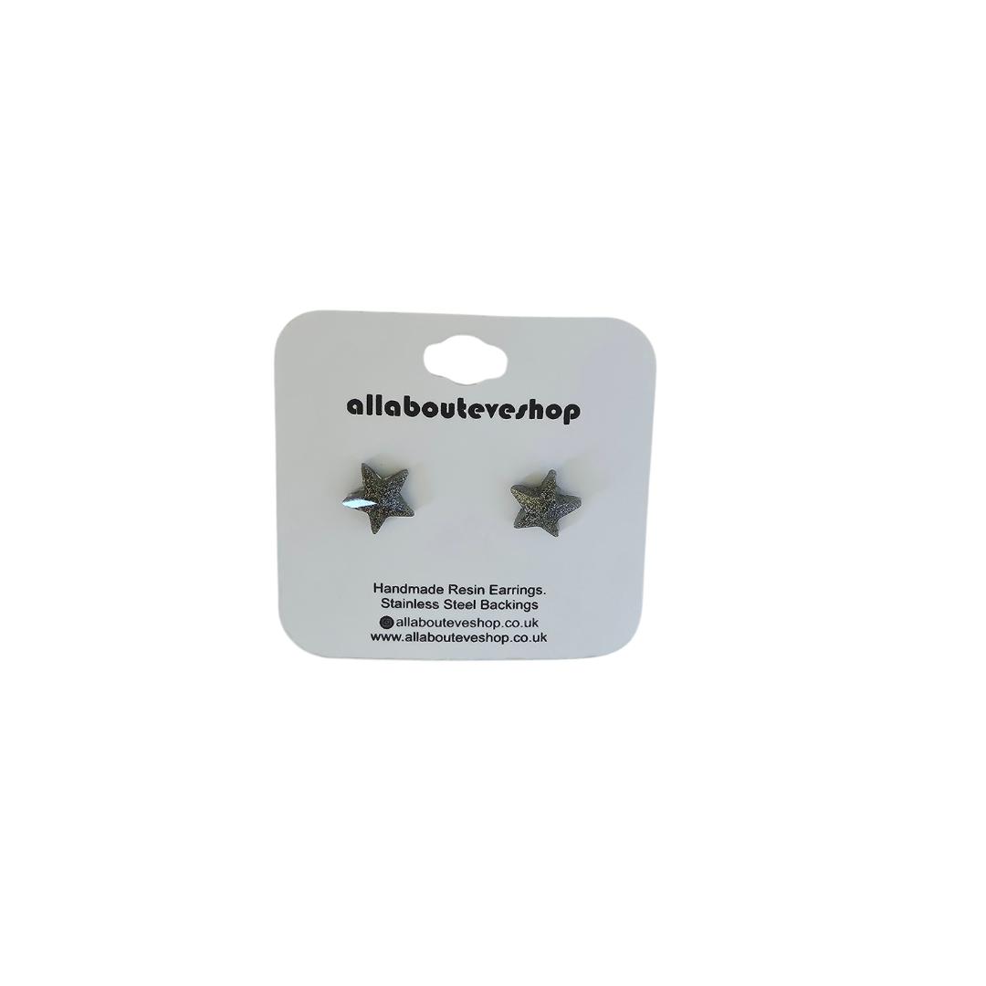 Silver star stud earrings with stainless steel backing.